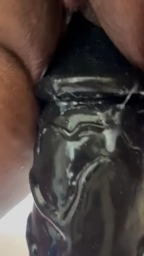 Trying to get this big fat dildo all the way in