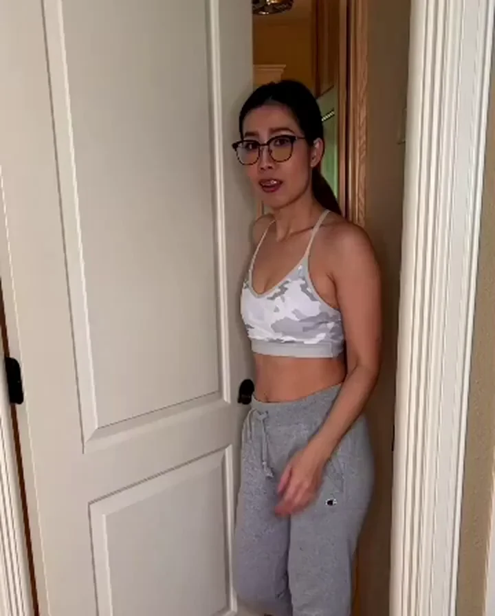 Ex's Sultry Doorway Tease: Asian MILF in Lacy Bra & Grey Joggers