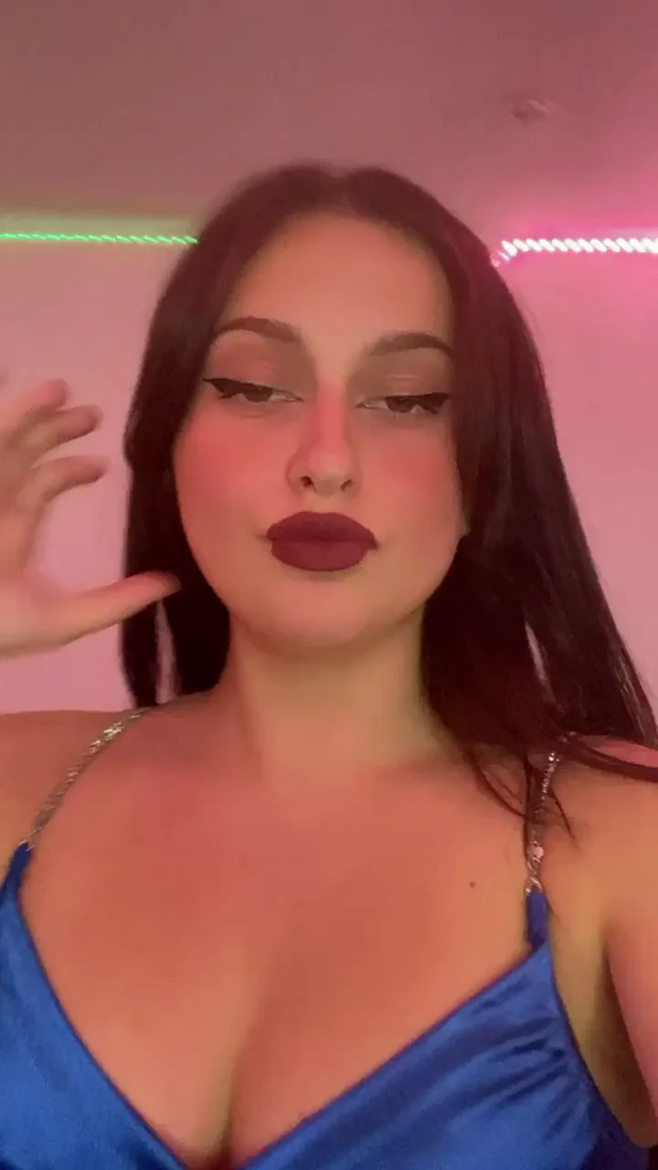 Neon Slut's Perky Tits Tease in Shiny Blue Dress
