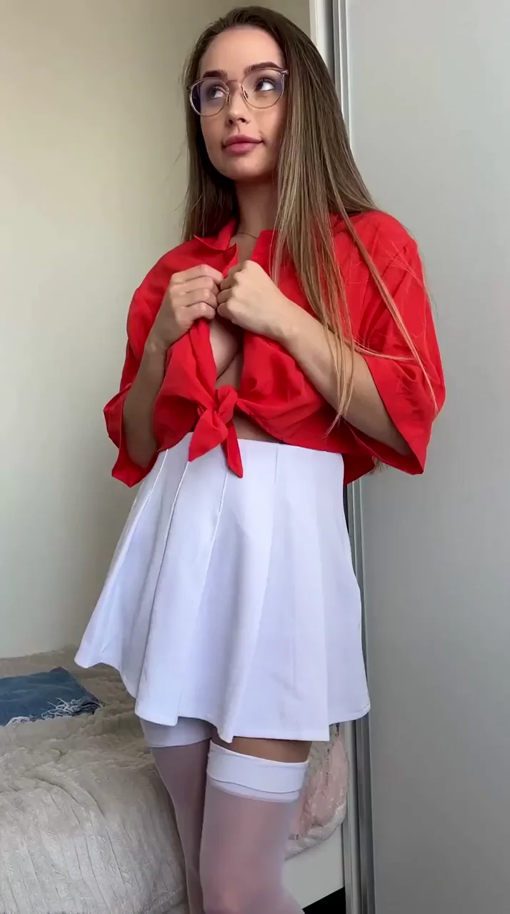 Four-Eyed Nerd Slut Teases Her Massive Tits in Red Top & Mini Skirt