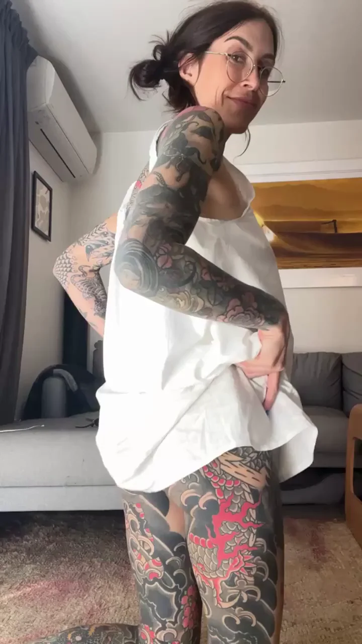 Tattooed Slut Teases What's Hiding Under Her Slip