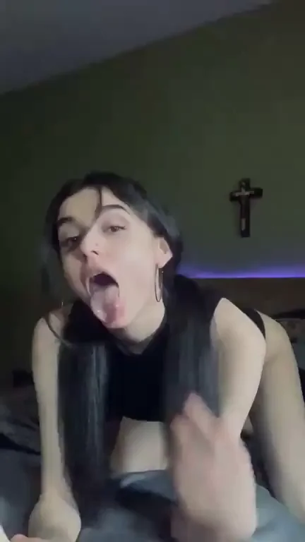Blasphemous Babe Sucking Dildo Under Jesus' Gaze