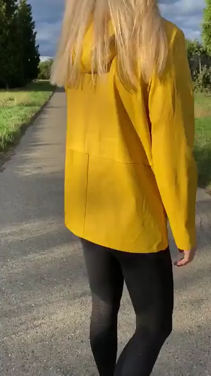 Blonde Slut Flashes Massive Tits Under Yellow Coat on Outdoor Path