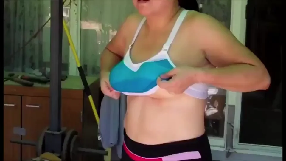 Unknown Woman Freeing Her Saggy Tits From A Sports Bra