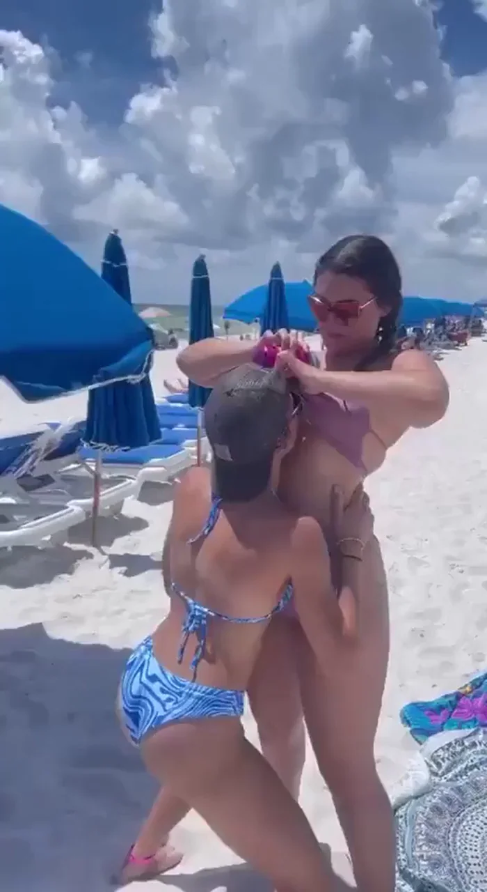 Girl sucking tits on the beach