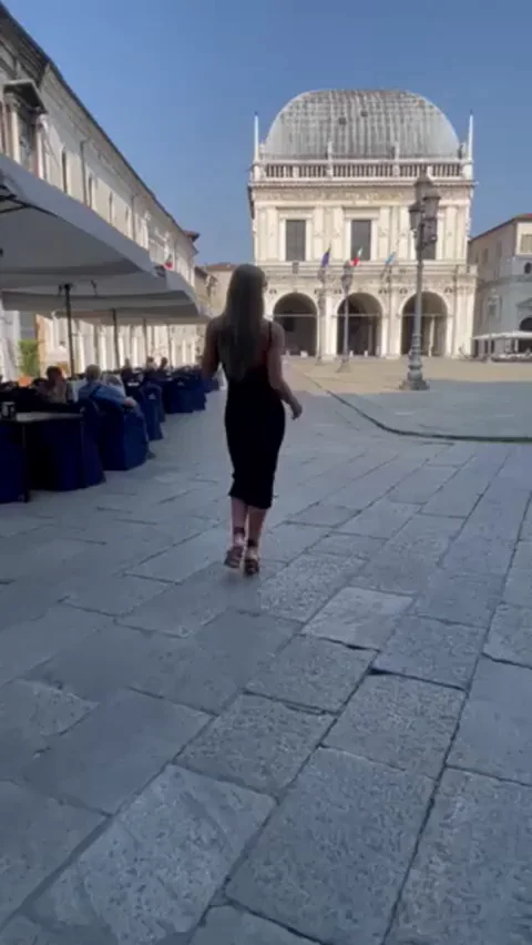 Hot girl stripping naked in the middle of the city square
