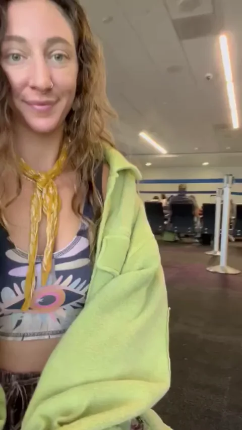 Sneaky Airport Tit Flash Before Takeoff [GIF]