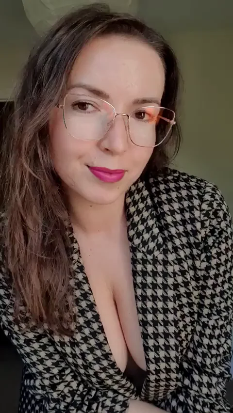 Brunette Bombshell's Downblouse Tease: Tits Spilling Out!