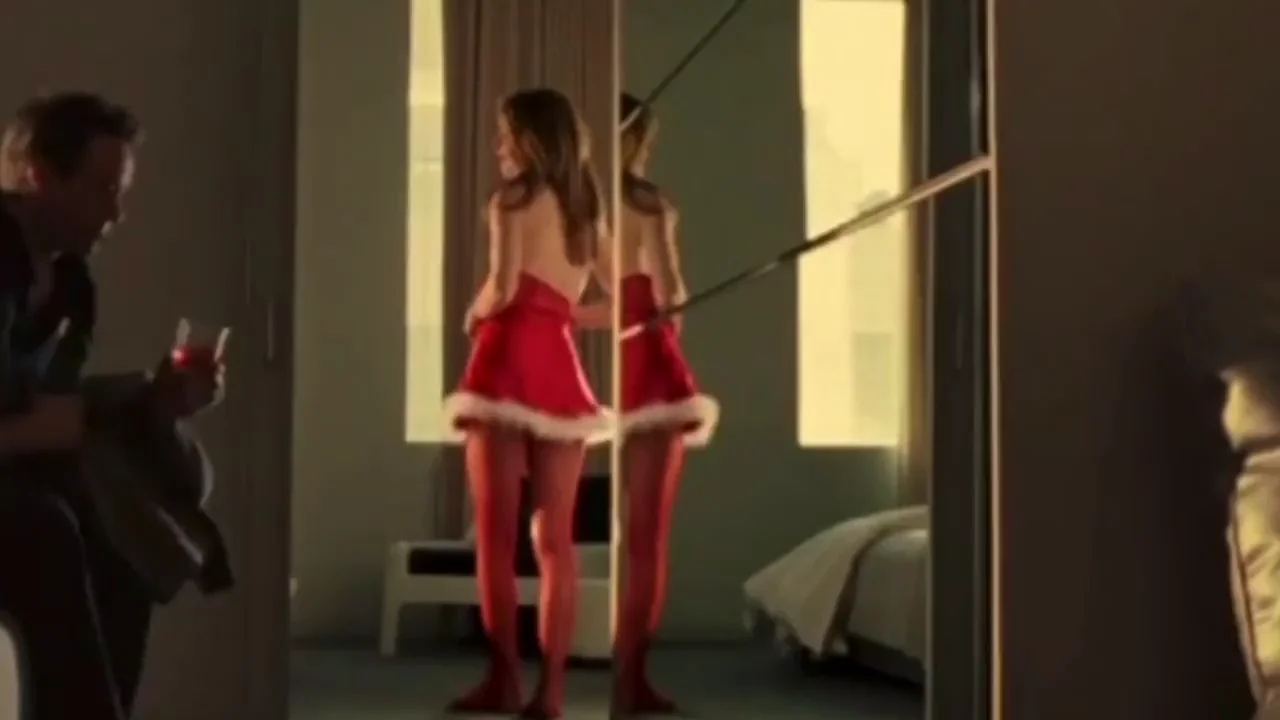 Michelle Monaghan strips out of her little Santa dress in Kiss Kiss Bang Bang. 2005