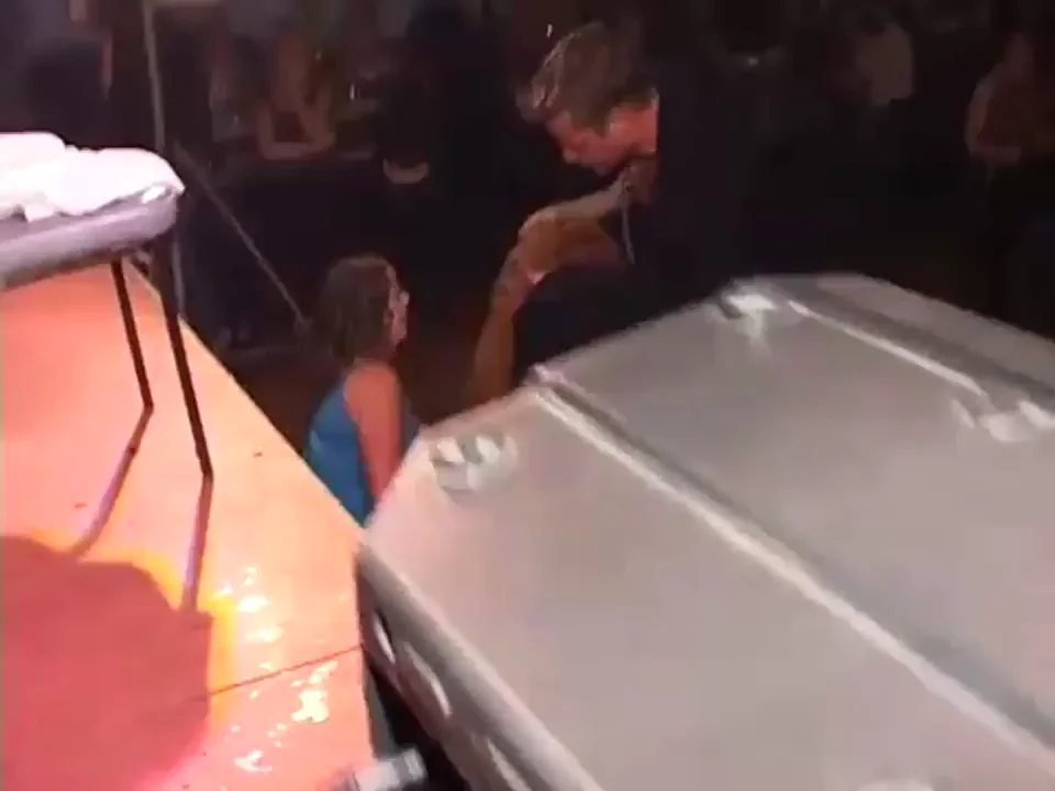 Male stripper Dynamite getting his cock sucked by two milfs behind his cape.
