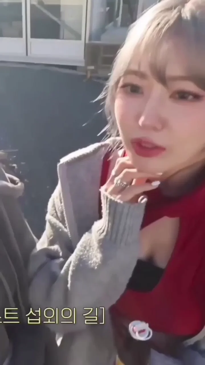 Le Sserafim Sakura Teasing Cleavage in Red Cutout Top