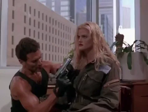 Anna Nicole Smith's Skyscraper Gun Tease: Massive Tits Spill Out