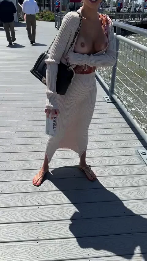 Windy Boardwalk Tease: Nipples Popping Out in Public 😏💨🍒
