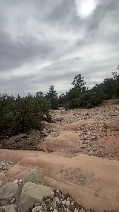 Sprinting naked over sleet rock in the rain