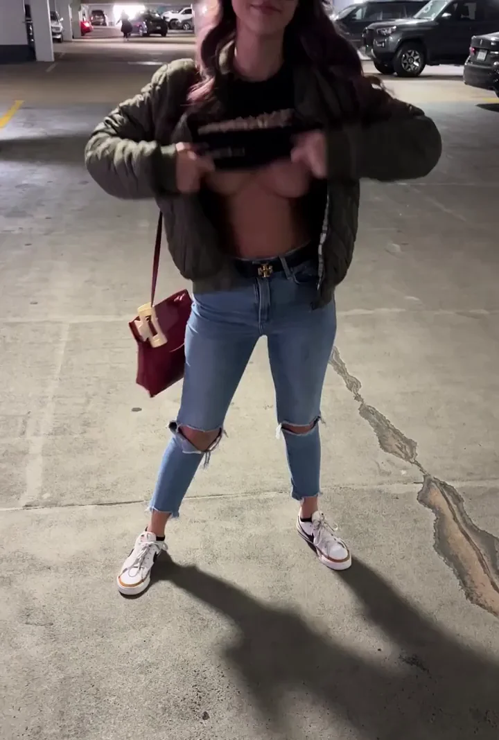 Parking Garage Titty Flash: Slutty Bomber Babe Goes Topless