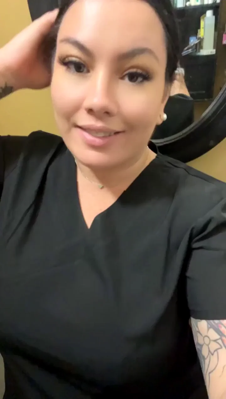 MILF nurse showing off tits