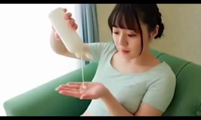 Rubbing lotion all over herself