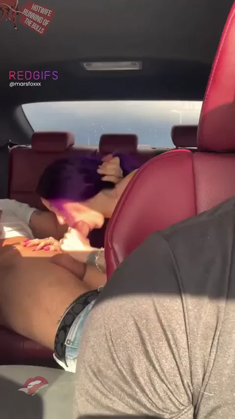 Purple-Haired Slut Welcomes Swinger Guest with Airport Roadhead in Luxury Ride
