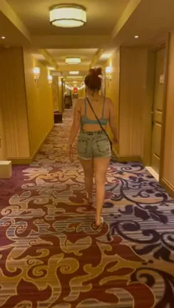 Redhead Slut Flaunts Juicy Ass in Hotel Hallway Tease