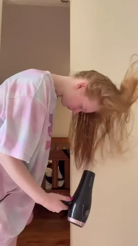 Redhead Babe Brushes Her Long Hair, Teasing Strip in Oversized Tee