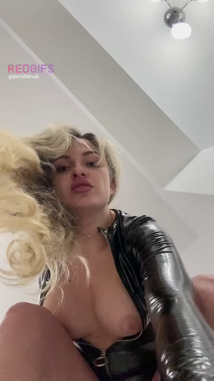 Lip Tease in Shiny Latex Bodysuit