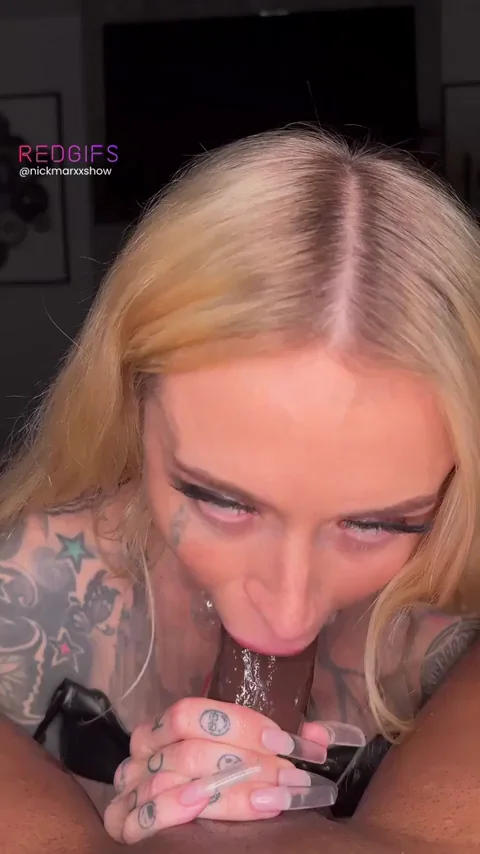 Blonde Inked Slut Deepthroats Cock on Bed's Edge 🍆💦