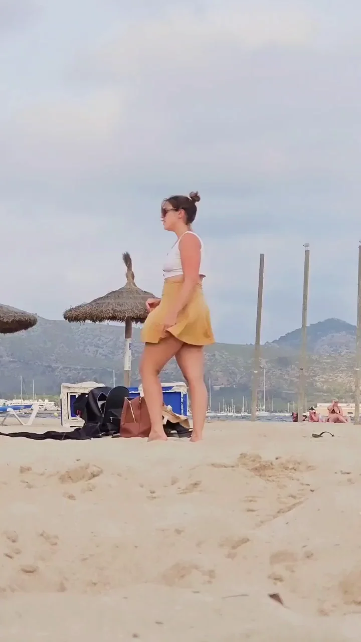 Upskirt pussy on show at the beach