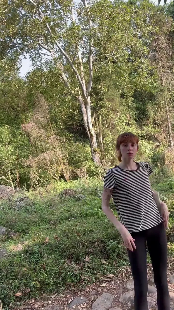 Petite Redhead Teases Cute Tits in Jungle Flash
