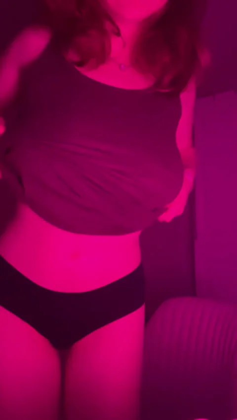 Hot Babe Teases Massive Tits in Sultry Pink Glow vs Total Darkness