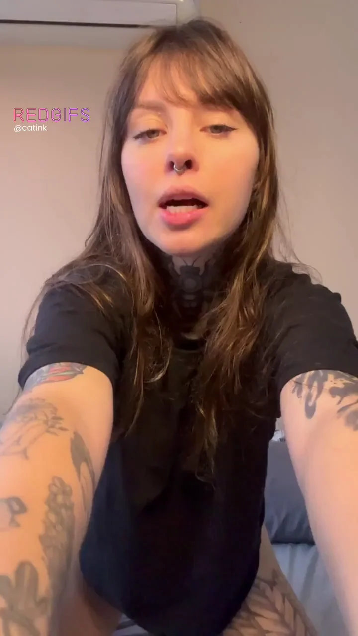 Goth Slut with Tied Hair Teases Her Inked Curves