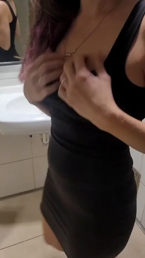 Secretly flashing in a bathroom at a rooftop party