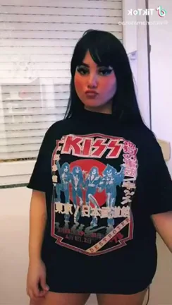KISS Titties Tease: Rockin' Oversized Jugs in Pink Crop!