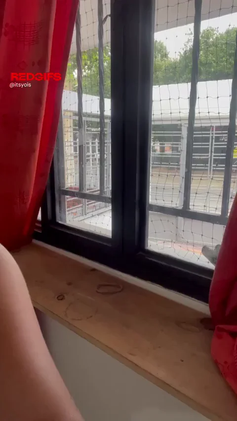 Teen Slut Flaunts Her Perky Tits at the Window