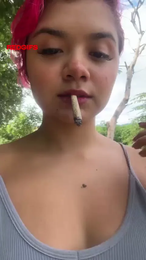 Pink-Haired Slut Smokes Joint, Teases Perky Tits in Outdoor Tease