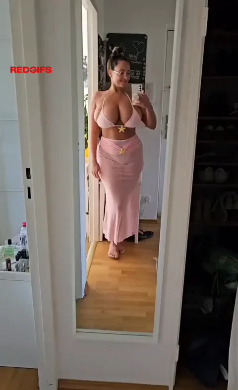 Curvy MILF Teases in Tight Pink Bikini