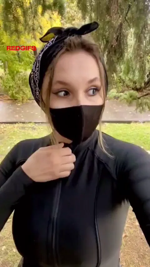 Busty shy girl reveals in a park