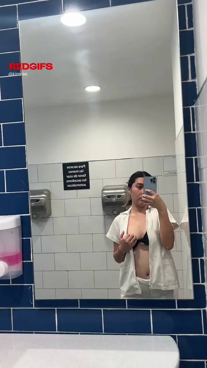 Nurse Slut Flashes Perky Tits in Work Bathroom Mirror
