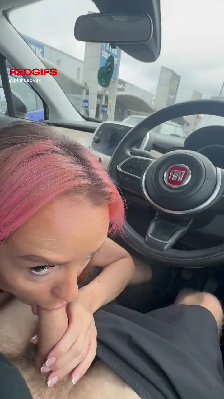 Pink-Haired Slut Sucks Cock in Car with Crowds Watching