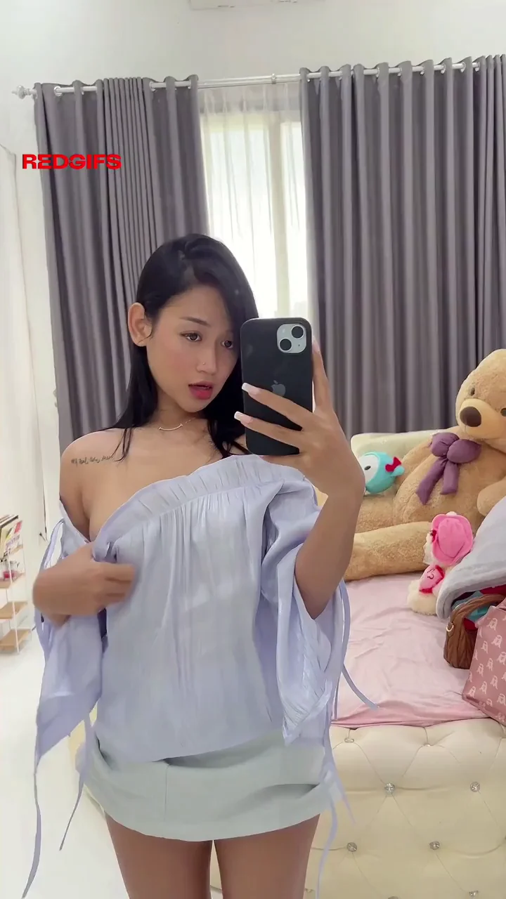 Sweet asian chick reveals her small tits for the world to see