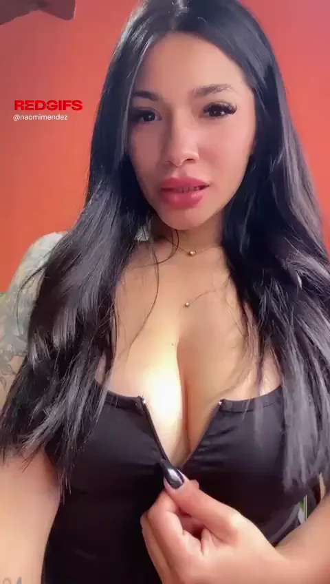 Hot Asian Babe Unzips Her Massive Natural Tits