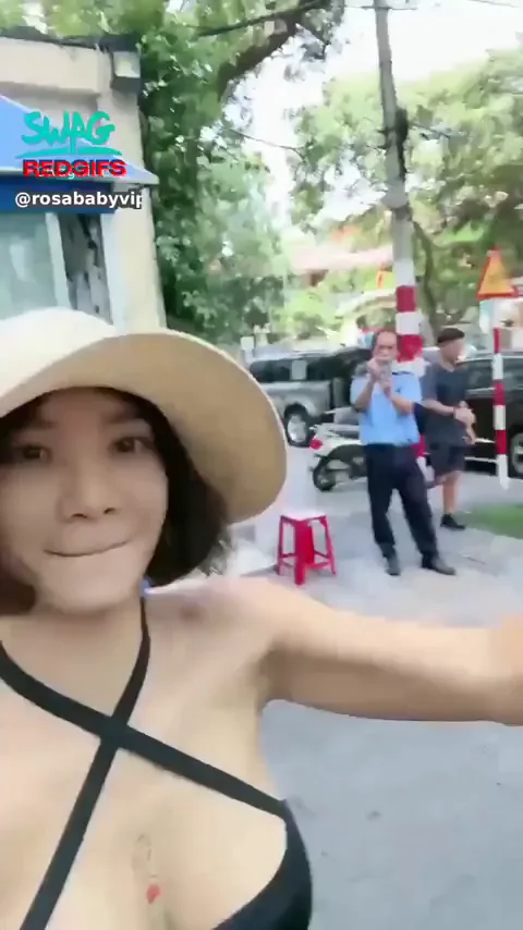 Asian Beach Babe Flashes Massive Tits to Cameraman in Public Tease