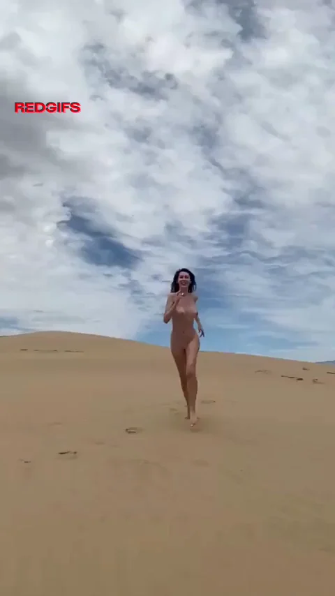 Busty Babe's Long-Legged Nude Strut on the Dunes