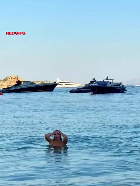 Busty Bombshell Emerges from Ocean in Slutty Micro Bikini