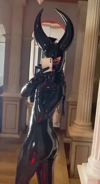 latex devil, dripping in shine and sin