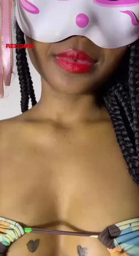 Pouty Masked Ebony Babe Teases with Glossy Lips & Spilling Cleavage