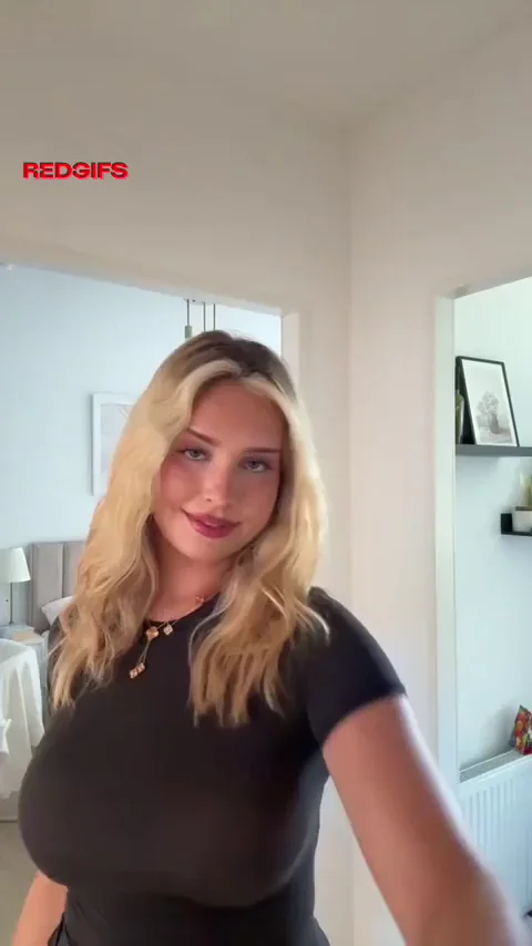 Busty Blonde Bombshell in Black Top and White Mini Skirt