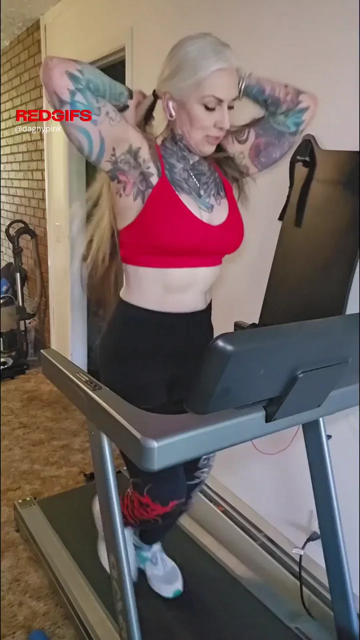 Inked MILF's Massive Tits Bounce Wild on Treadmill