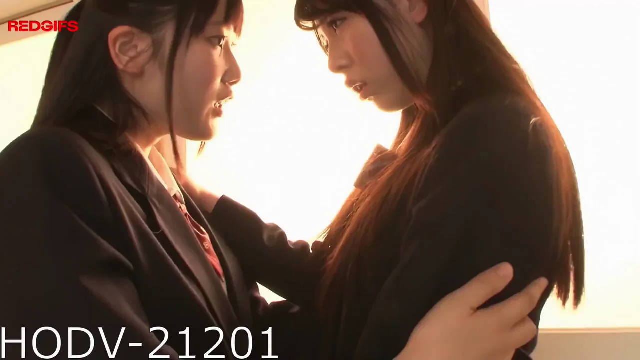 Two women share a kiss so soft the whole world pauses