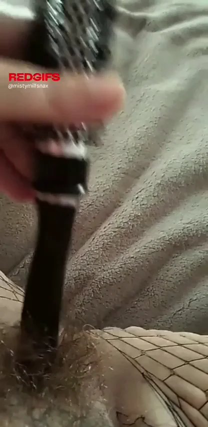 MILF Shoves Hairbrush Deep in Her Juicy Pussy