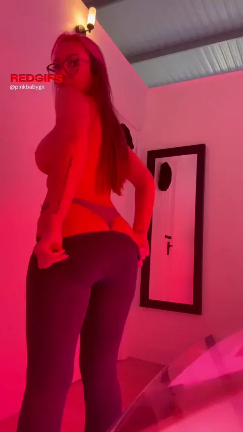 Sunbed Slut Tease: Massive Tits Spill Out in Red Gym Glow